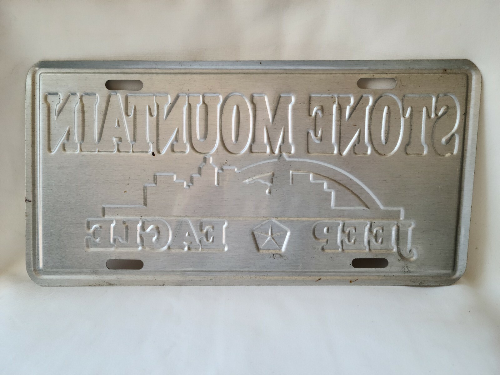 Vintage Stone Mountain Jeep Eagle Metal Booster License Plate