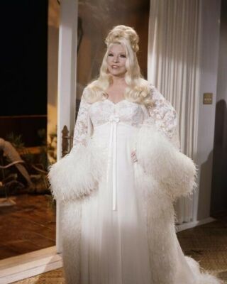 Mae West classic pose in white gown hands on hips Myra Breckinridge 8x10 photo
