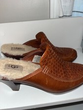 UGG  shoes with heel, Ladies size 8, Brown in color and in good condition 