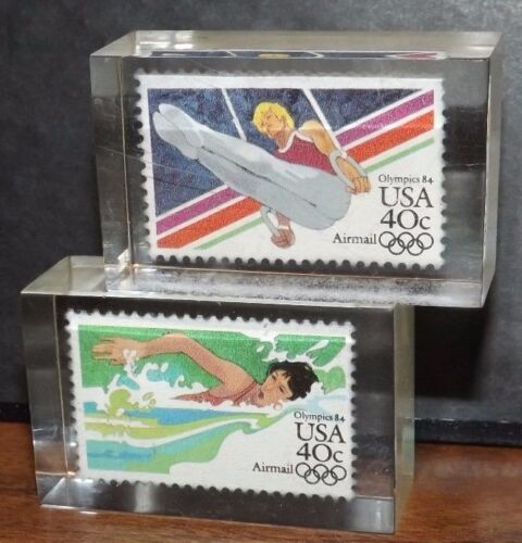 Rare 1984 Winter Olympics 2 Postage Stamps in Lucite Gymnastics Rings Swimming - Afbeelding 1 van 3