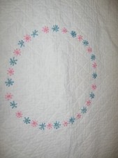vintage embroidered pink blue and white baby quilt