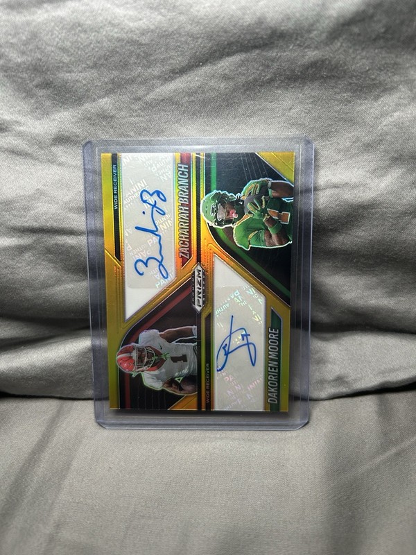 2025 Prizm Black NIL Zachariah Branch/ Dakorien Moore Auto Gold /10