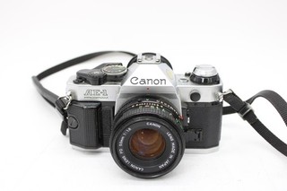 T Canon AE 1 Program 35mm SLR film Camera w/ Canon FD 1.8 50mm Lens