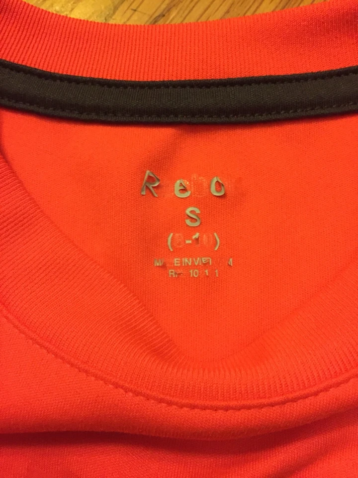 Camiseta Reebok Manga Corta Naranja Neón Niñas - Talla Pequeña (8-10) (GUC) Foto 2 de 2