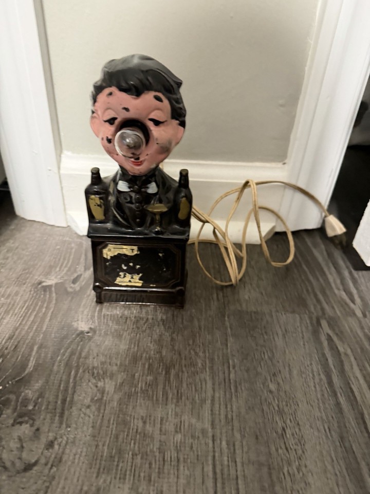 A Charlie Chaplin nose lamp that doubles as a 'Bar Is Open' sign — peak MCM hobo kitsch barware that is equal parts functional novelty and conversation piece.