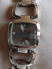 Gucci woman’s silver watch with mother of pearl face. Used in good condition