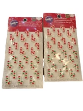 2 Christmas candy canes Icing Decorations Wilton NEW edible cupcake cake topper