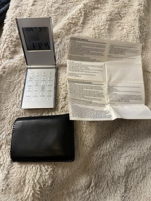 Ewiger Kalender, 8-stelliger Taschenrechner, Weltzeituhr und Reisewecker