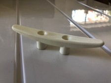 White plastic cleat small sailing dinghy keelboat yacht