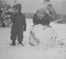 Children Playing in Snow Building Snowman Joyful Winter 1952