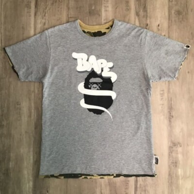 Reversible BAPE × KAWS bendy 1st camo T-shirt NIGO A Bathing Ape