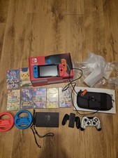 Nintendo Switch Neon Blue/Red Bundle Mario Kart 8, Pokemon Games And More