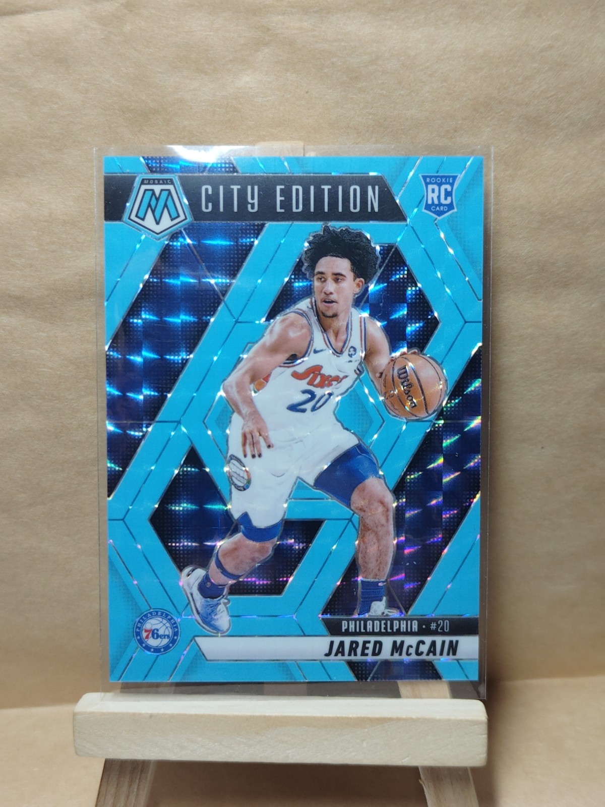 2024-25 Panini Mosaic  Jared McCain City Edition Blue Fluorescent Mosaic 1/75 RC