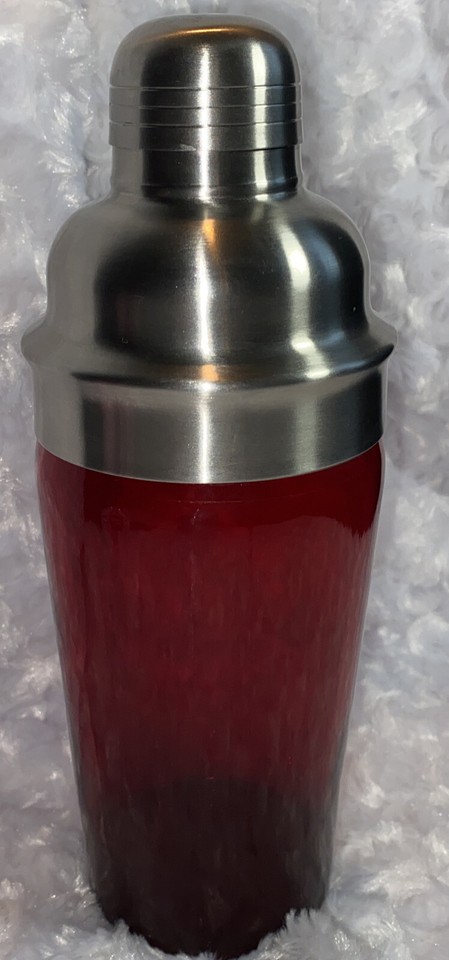 A ruby red MCM cocktail shaker that looks like it belongs in a Rat Pack movie — genuinely striking barware you'd proudly display.