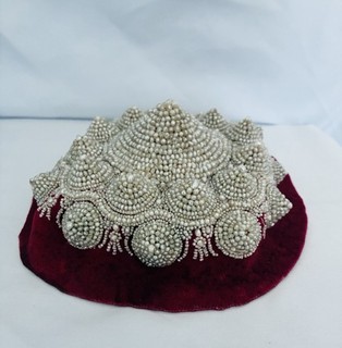 Vintage/traditional tepeluk—a conical Balkan folk cap/ornamental headpiece/hat