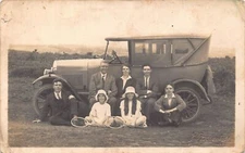 L032 Family posing social history Automobile overland vintage postcard RPPC