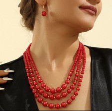 Pierced gold and red bead three strand necklace and earring set