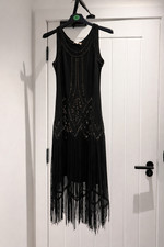 Black Sequin fringe dress Sleeveless flapper style for evening party.