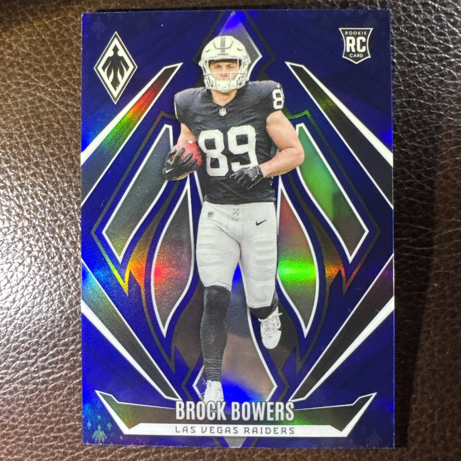 Brock Bowers 2024 Panini Phoenix #165 Blue Rookie RC 21/50 SP Raiders