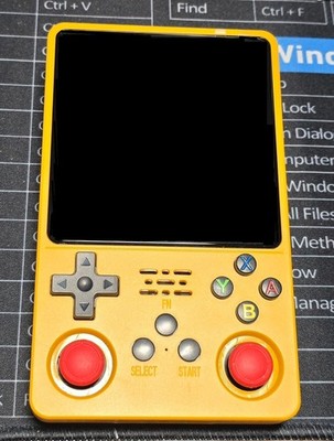 R36 Plus Handheld Yellow (NEW) with loaded 64gb Micro SD Card