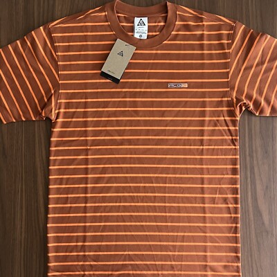 brown and orange nike shirt