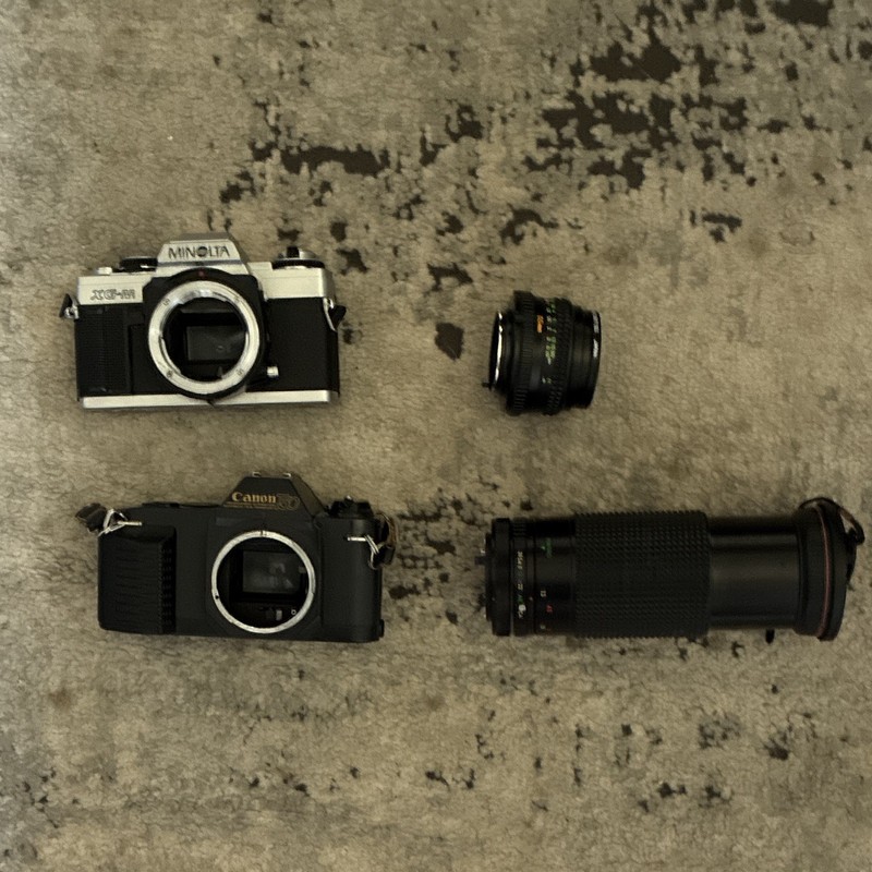 Minolta XG-M & Canon T70 Vintage 35mm SLR Camera Bodies w/ Lenses Black/Silver