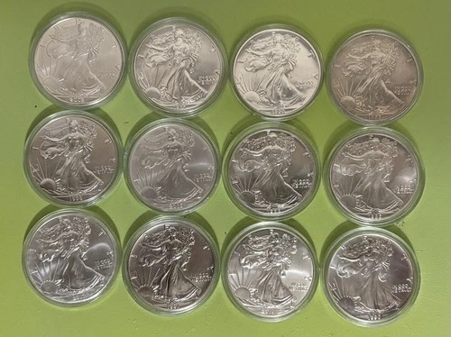 Set of Twelve American Silver Eagle 1oz .999 Fine One Dollar Coin (in capsules).