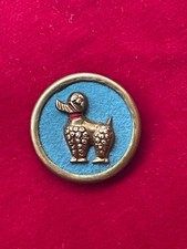 Antique Brass Poodle Button on Blue Felt Background 30mm Year 50