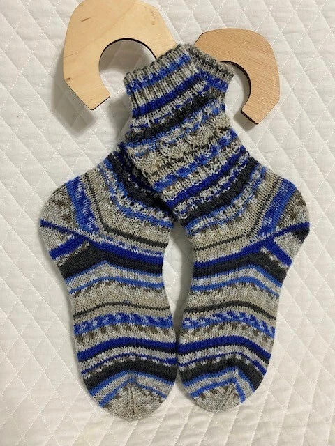 Hand knitted wool socks with a perfect fit on the bridge of your foot.