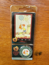 Disney Decades Coin and Card #20 "1977 The Many Adventures of Winnie the Pooh"