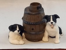 Leonardo Collection Two Black And White Border Collies Puppies Next To A Barrel.