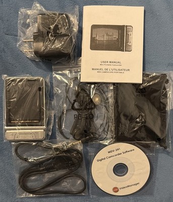 Sharper Image Model F3356771 Black Mini Camcorder & Camera w/128MB New In Box.