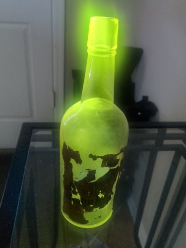Antique Liquor Bottle w/ Maganese Solarized Glass that Glows. Partial Orig Label