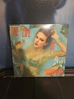 Taylor Swift The Life Of A Showgirl Portofino Orange Glitter Vinyl LP Open