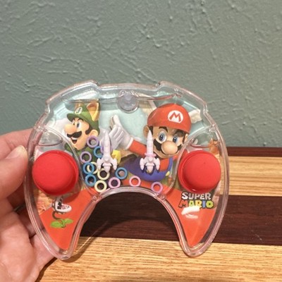Super Mario Bros. handheld water ring toss game looks like a game controller
