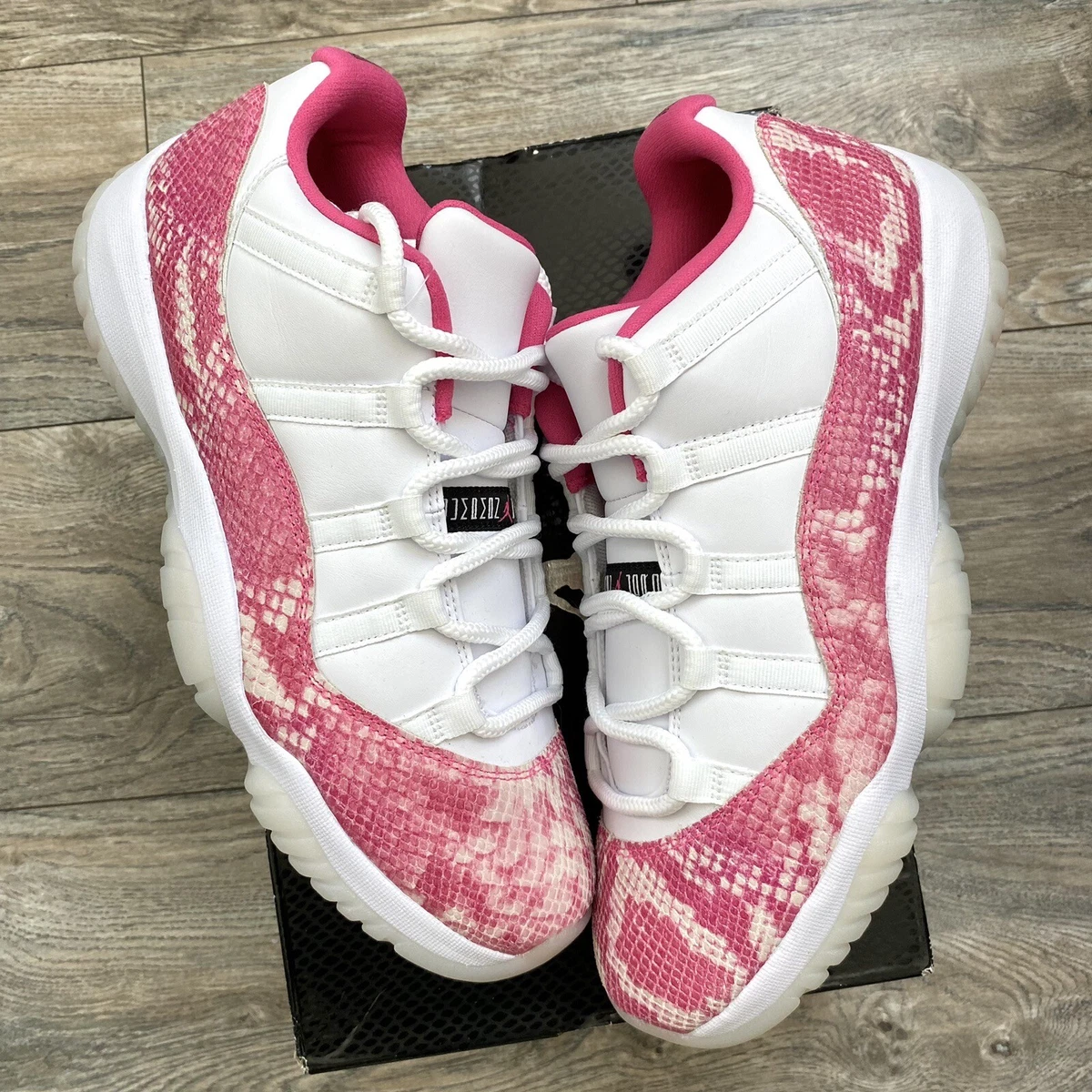 Pink 11 store jordans 2019