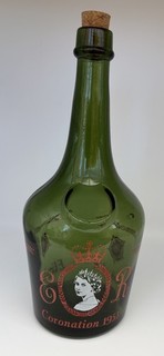 Green glass bottle commemorating the 1953 Coronation of Queen Elizabeth II.
