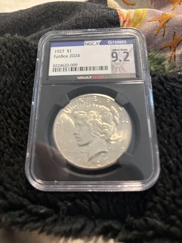 $1 1927 Peace NGC 9.2 (MS 62) Funbox
