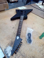 Used Electric Guitar ,strings need adjusted,Scratches on the neck