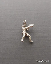 Limited edition sterling silver female tennis player charm measuring 21mmx13mm.