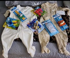 Bundle of baby clothes and toys