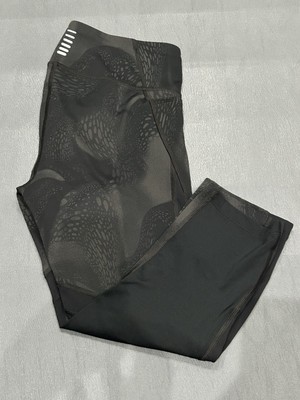 Under Amour Swirl patterned mid calf  leggings with hidden front tie.