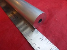 12" LONG 1 1/2" DIA. ALUMINUM ROUND BAR WITH 7/16" CENTER HOLE.