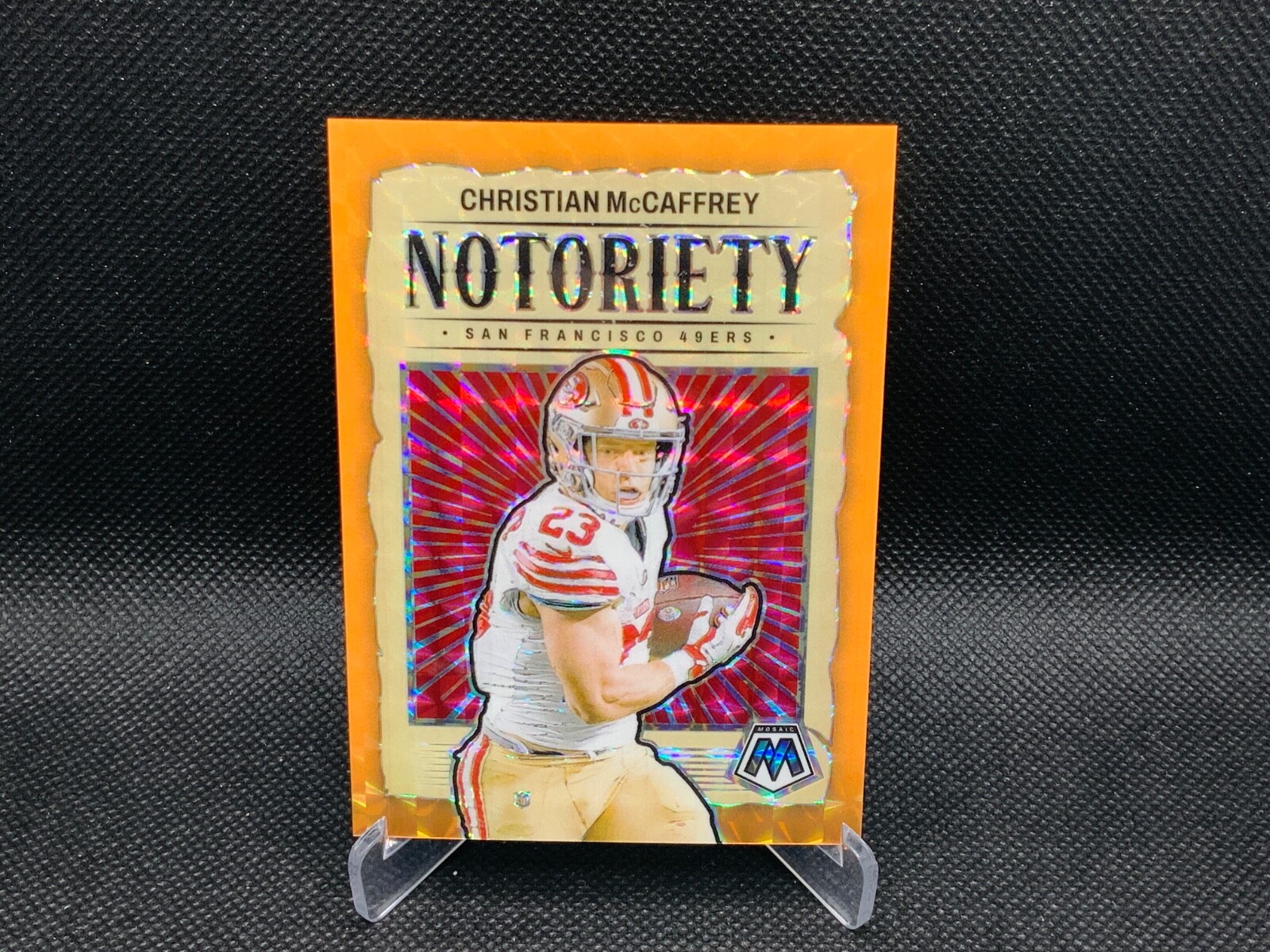 2024 Panini - Mosaic Christian McCaffrey No. 191 Orange Fluorescent Prizm (#/25)