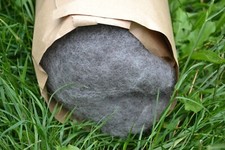 carded wool in natural medium grey as 1000g fleece from alpine stone sheep