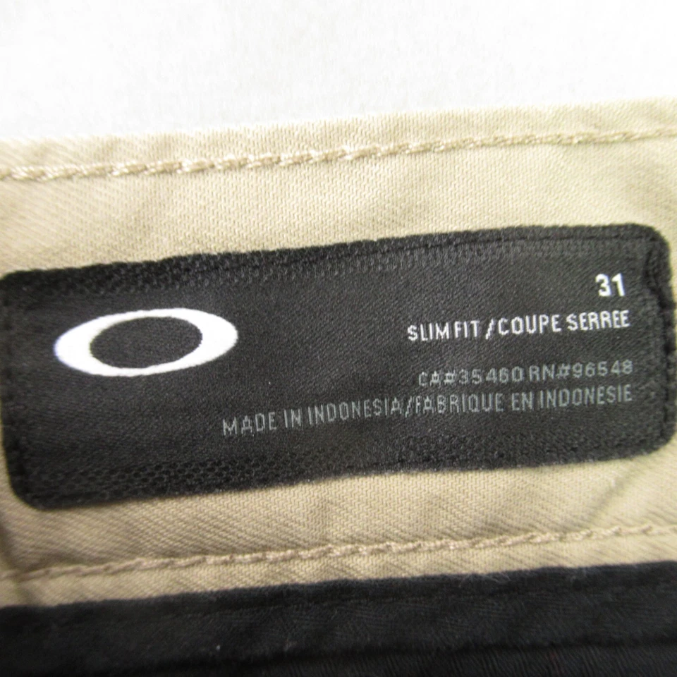 Pantalones Cortos Oakley Para Hombre 31 Bolsillos Botón Ligeros Exterior Chino Beige Calce Ajustado Foto 3 de 4