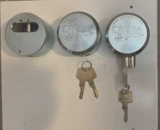 (4) “STEEL"COBRA” Flat Key Hidden Shackle PUCK LOCK (8) Keys- "NEW"