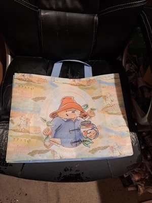 PADDINGTON BEAR blue duffel coat, red hat, suitcase, Pastel on rear of bag. - Image 1 of 3