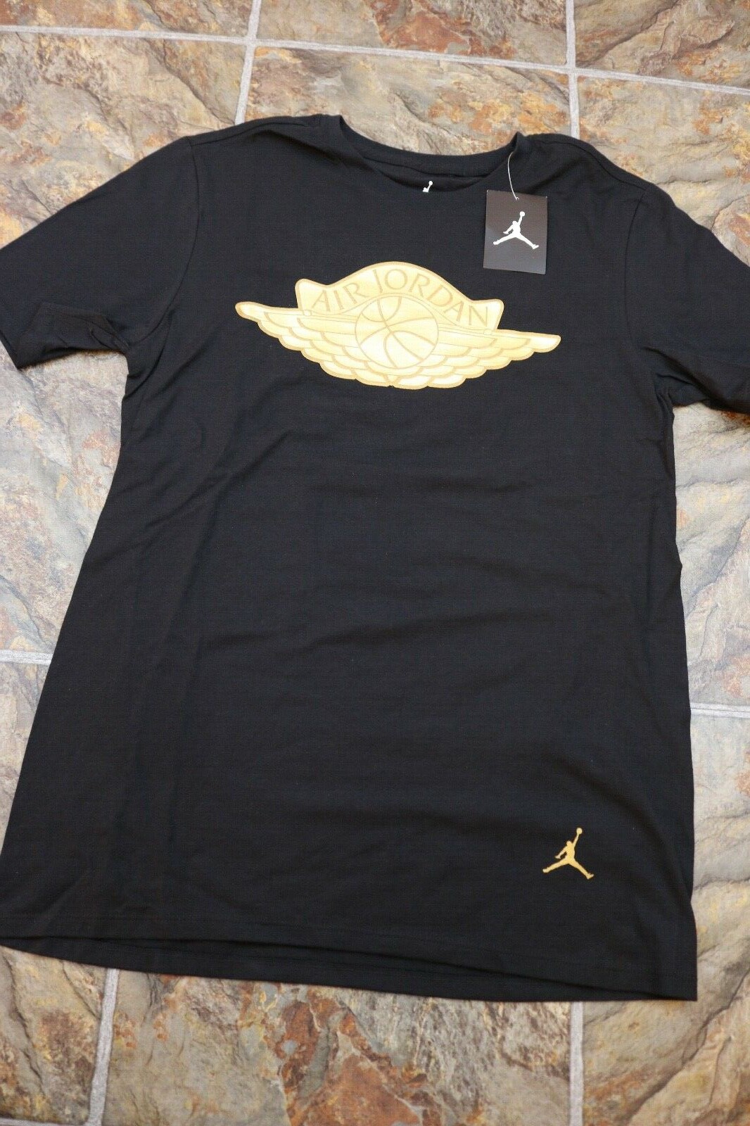 gold and black jordan shirt