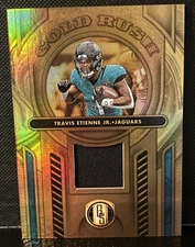 2024 Panini Gold Standard - Gold Rush Travis Etienne #GR-TEJ /299 (MEM)